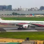 a large jetliner sitting on top of an airport runway